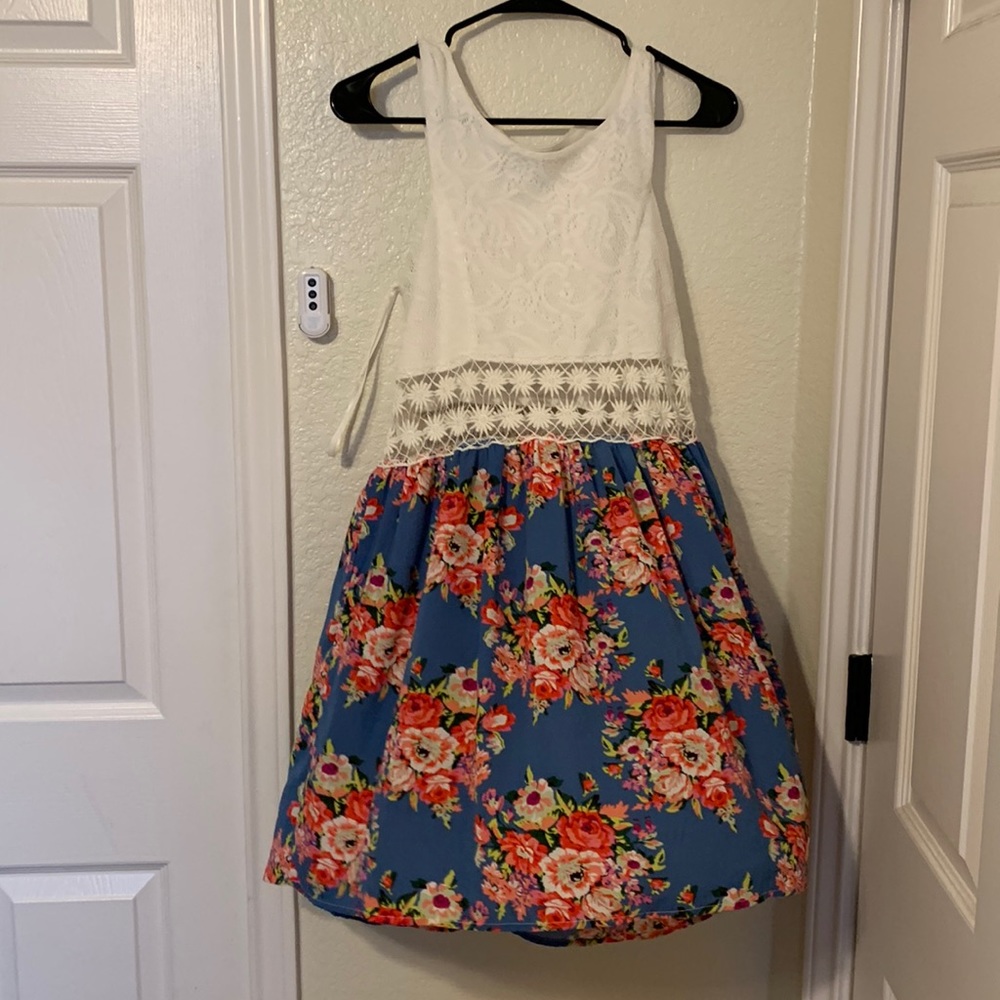 Only worn once. summery elegant short dress no longer needed in my closet